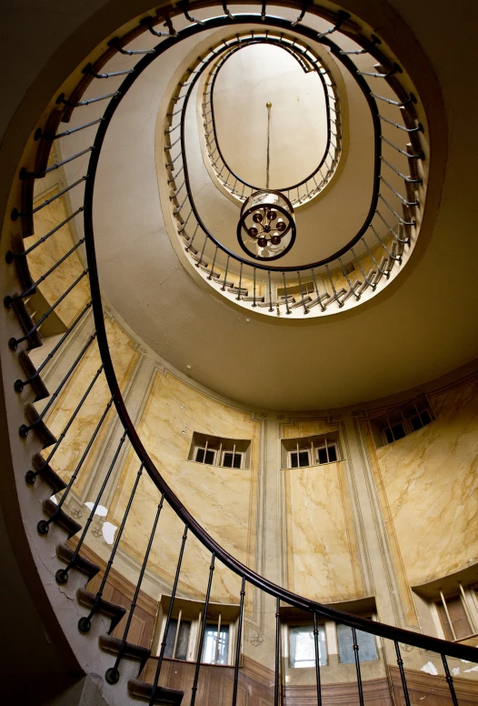 a very tall, spirally designed staircase with railings and railings