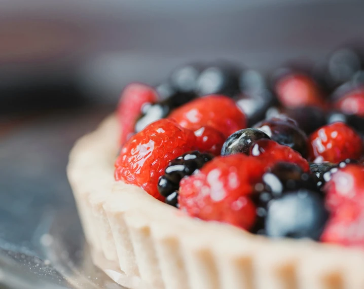 there is a tart with berries in it