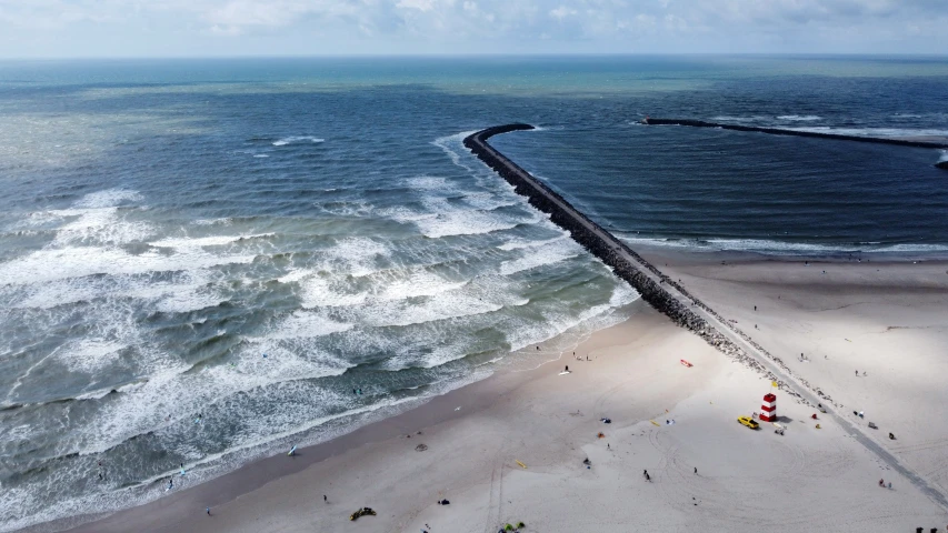 a road running along the shore in the ocean