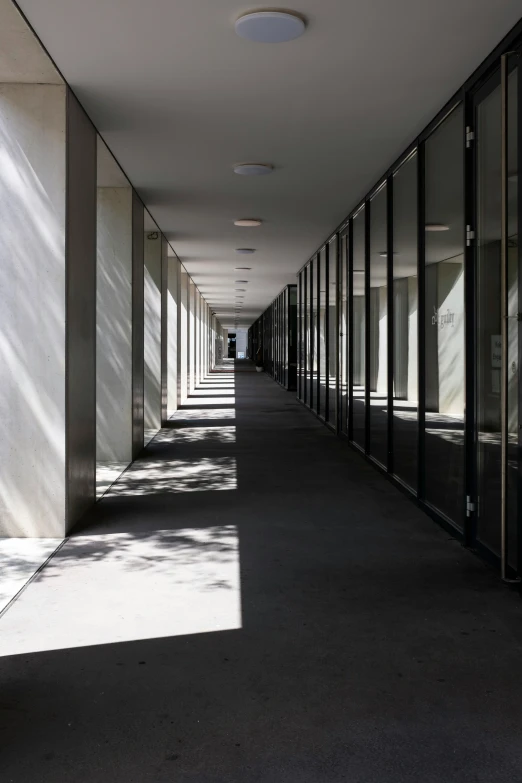 a hallway with lots of windows next to each other