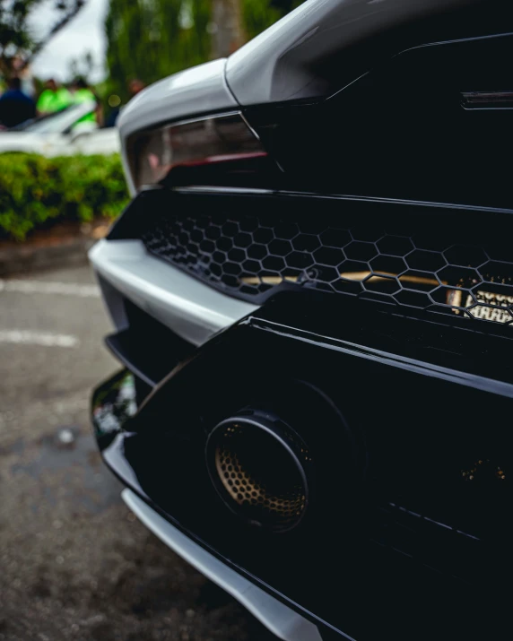 the hood of a car with some holes on it