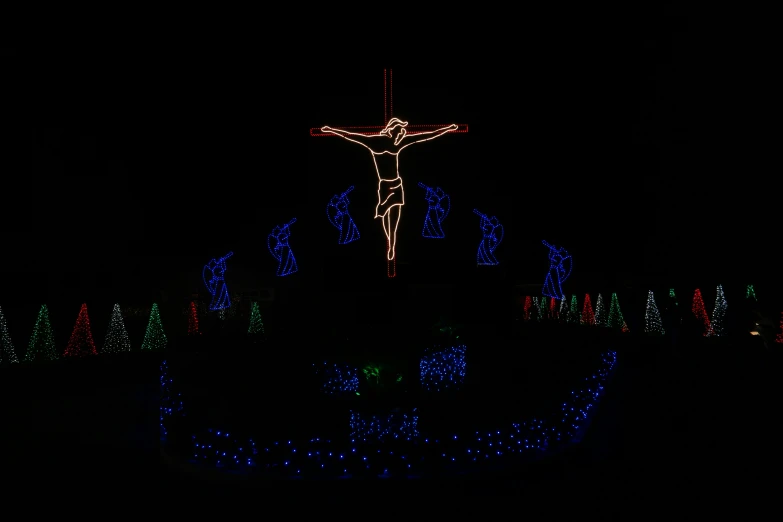 a person is illuminated on the background of christmas lights