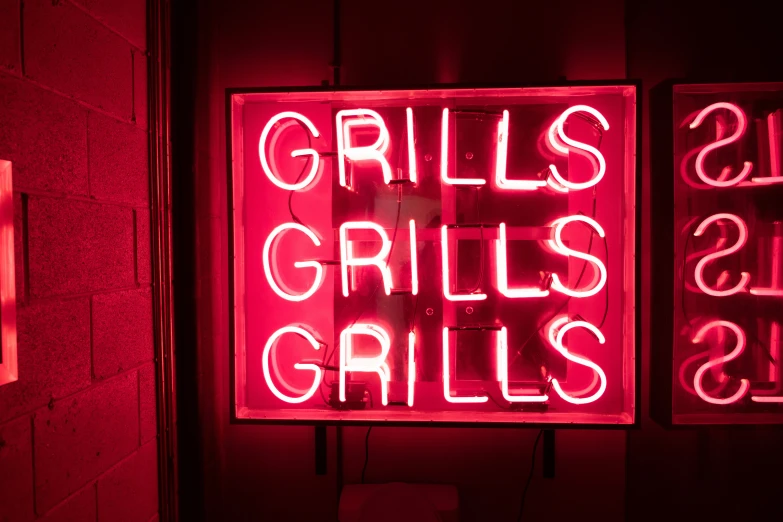 two neon signs that say, grills and bites