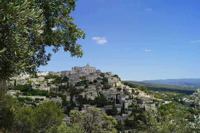 view over village in countryside surrounded by green vegetation