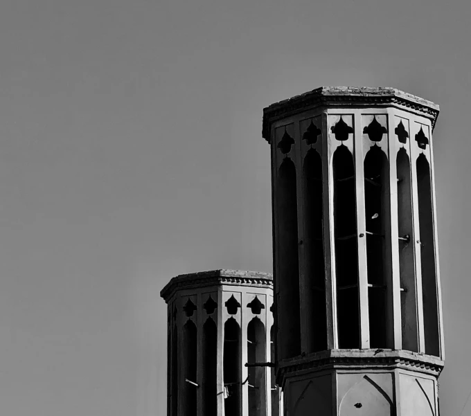 a large building with two towers on each