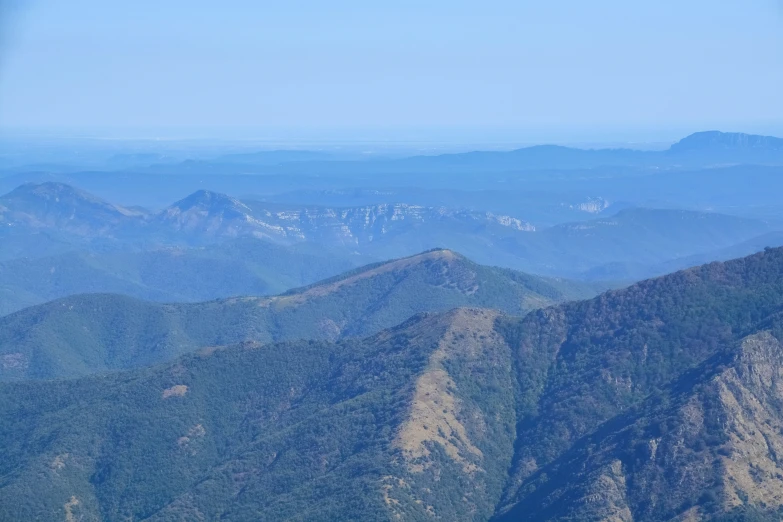 a mountain range with multiple mountains in the background