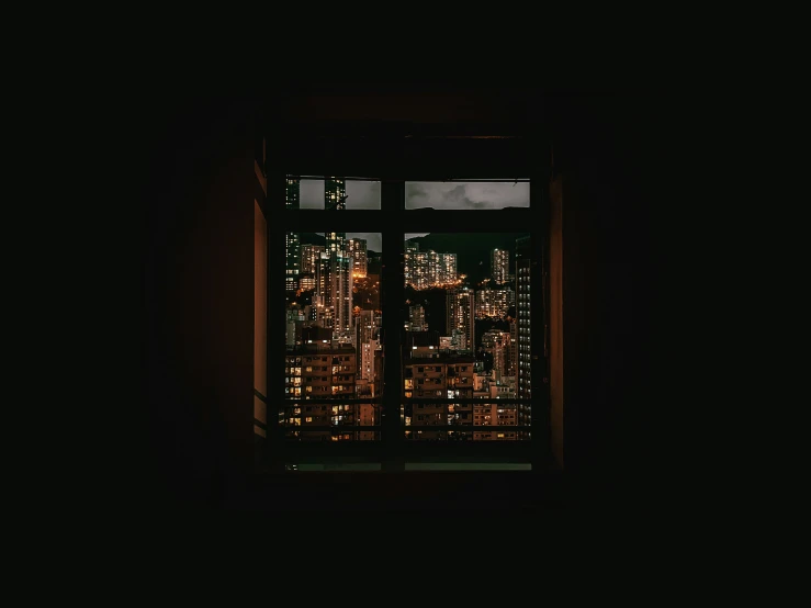 city lights visible through a window at night