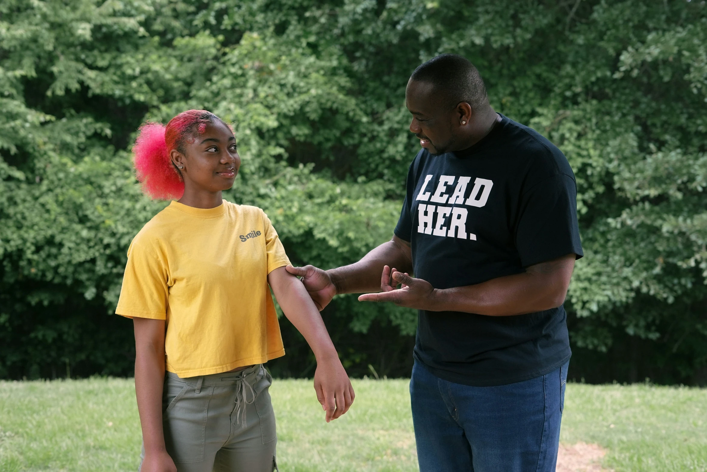 a woman holding hands with a man on the other side