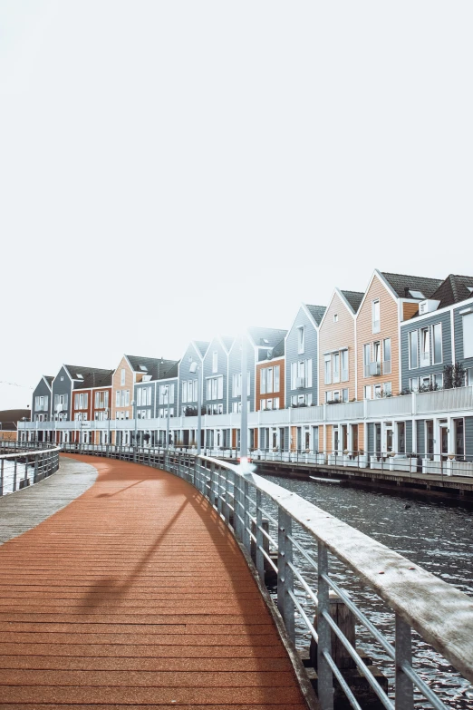 a row of townhouses line the edge of a harbor