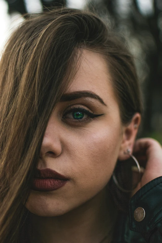 a woman with long hair and blue eyes