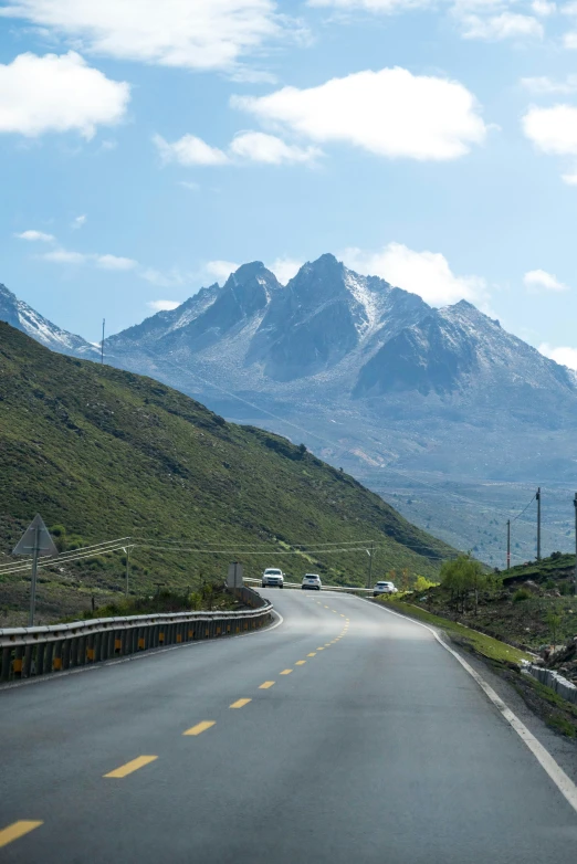 a view of the mountains from the road