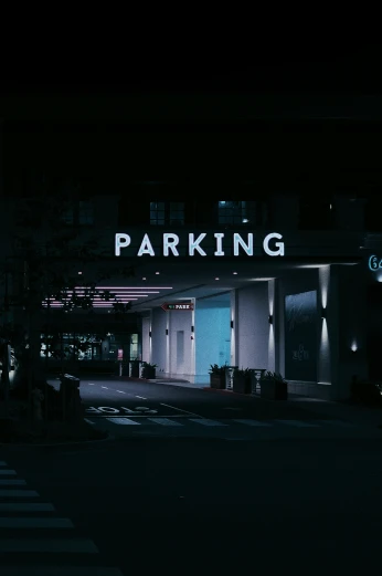 parking garage lit up at night in the dark