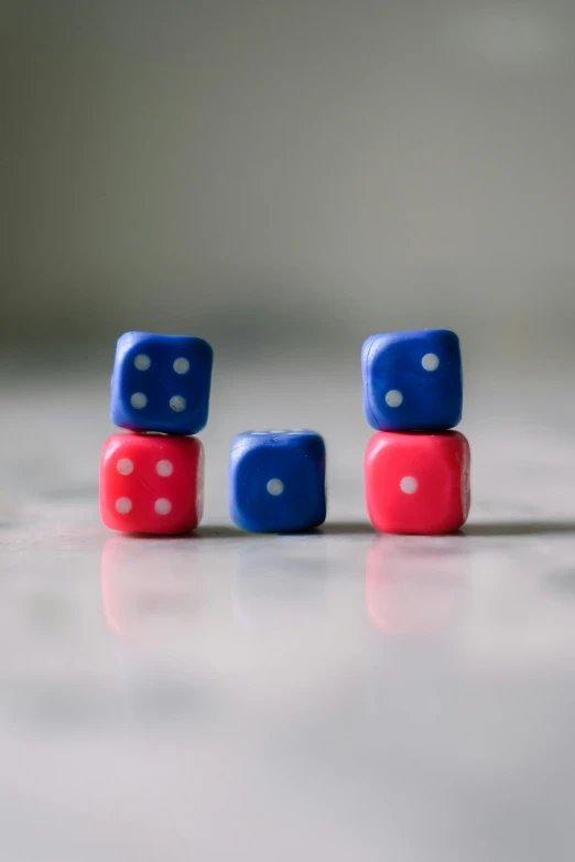 three blue dices sitting on top of each other