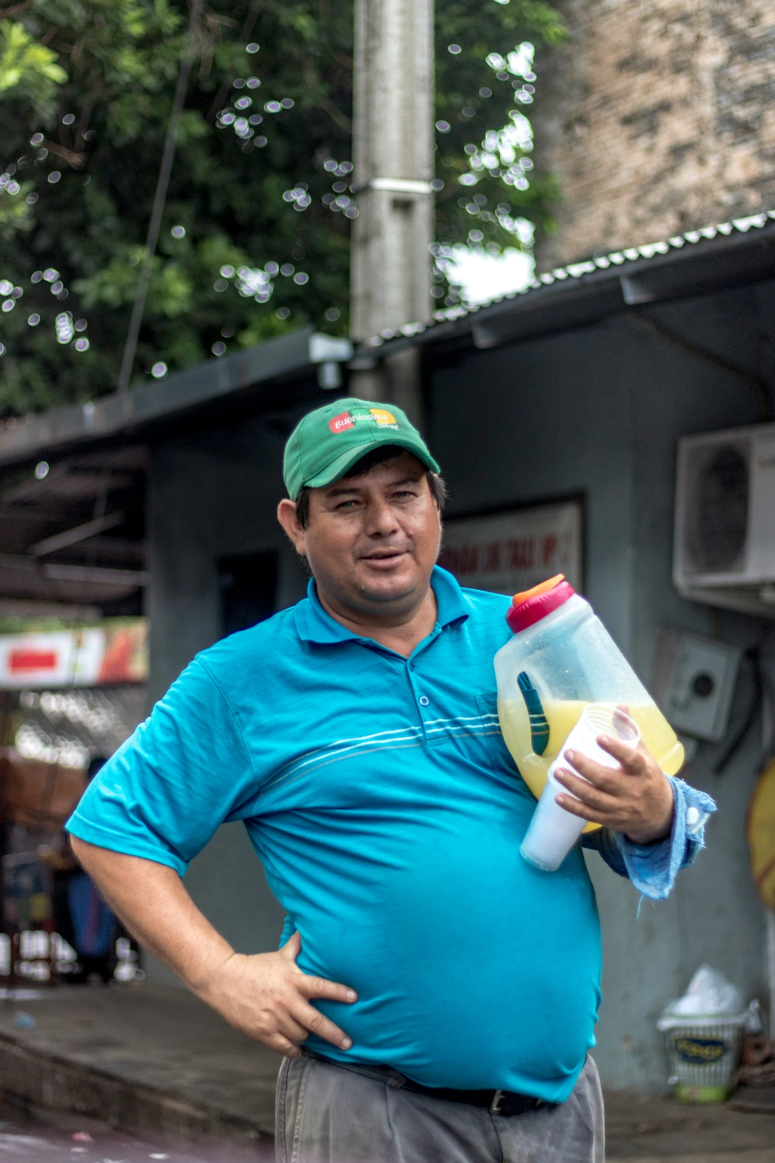 a man standing with his belly wrapped around a bottle