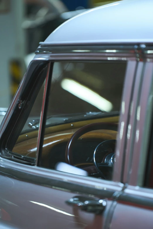 an older car with a shiny glass window