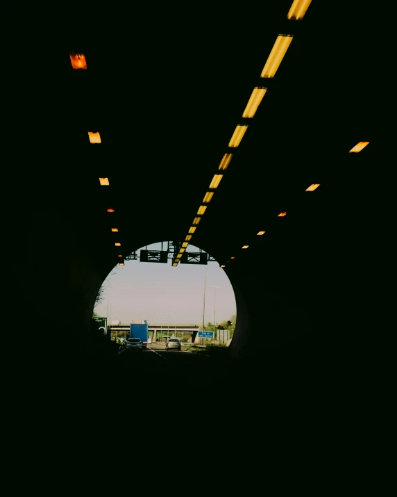 inside of a tunnel of light with lights at the end