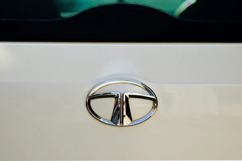 the emblem on a car's badge shows the letter k