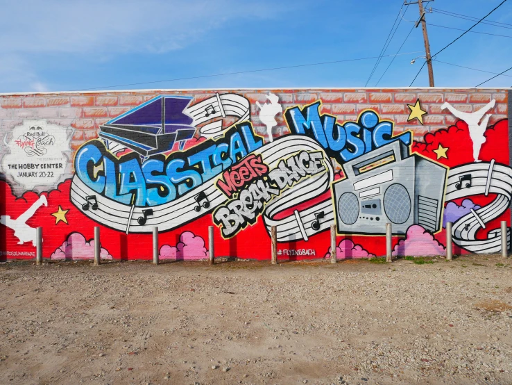 graffiti art on the side of a building with a piano