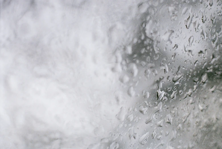 rain drops against a light gray sky