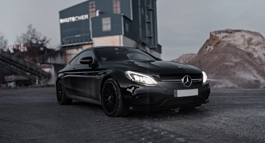 a mercedes benz coupe car parked in a parking lot