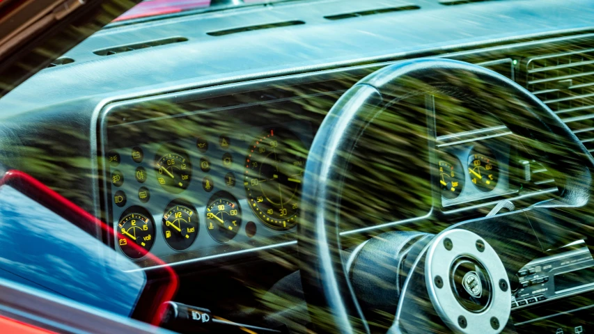 a car dashboard with a gauge and meter