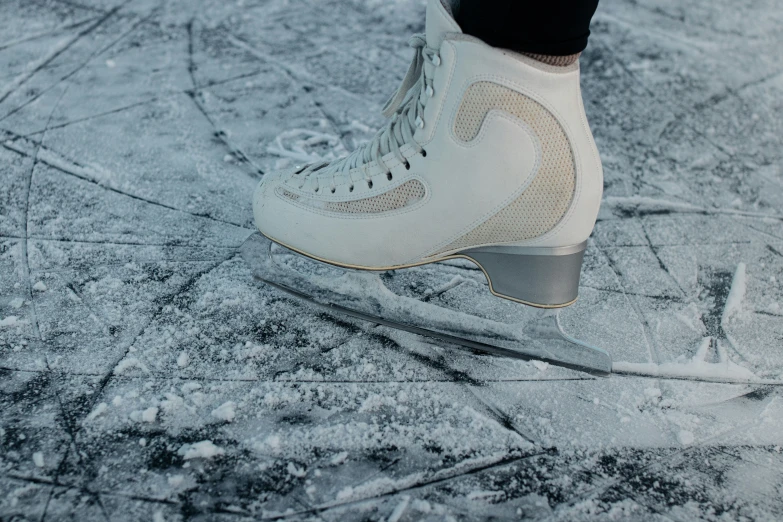 the ice skate is skating on the pavement