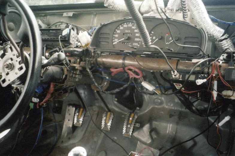 a dashboard view of an old looking vehicle