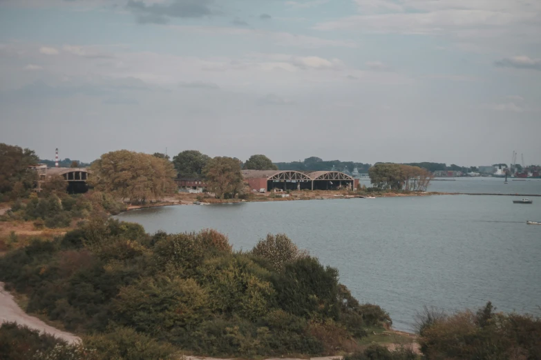 the trees are lining the shoreline near the water