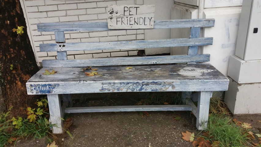 there is a bench outside of an old brick building