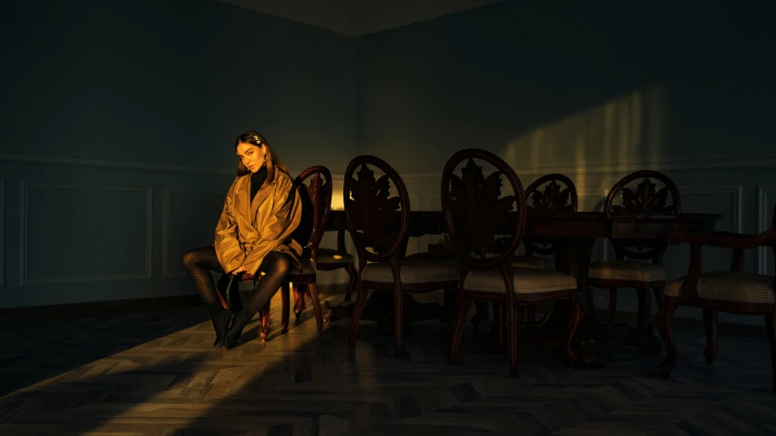 a woman sitting on a bench inside a room