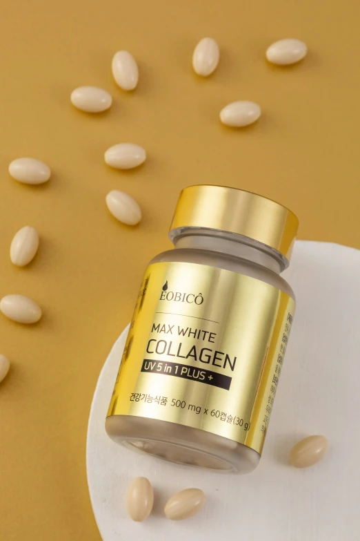 a bottle of collagen with white peanuts scattered on it