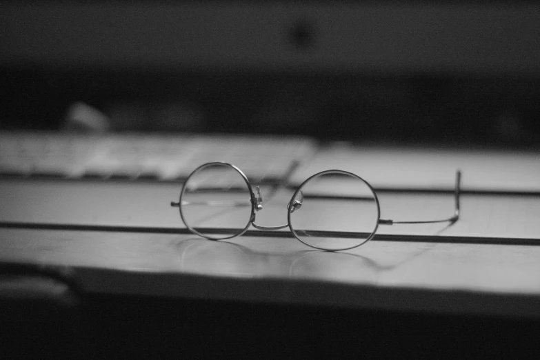 a pair of glasses are laying on a table