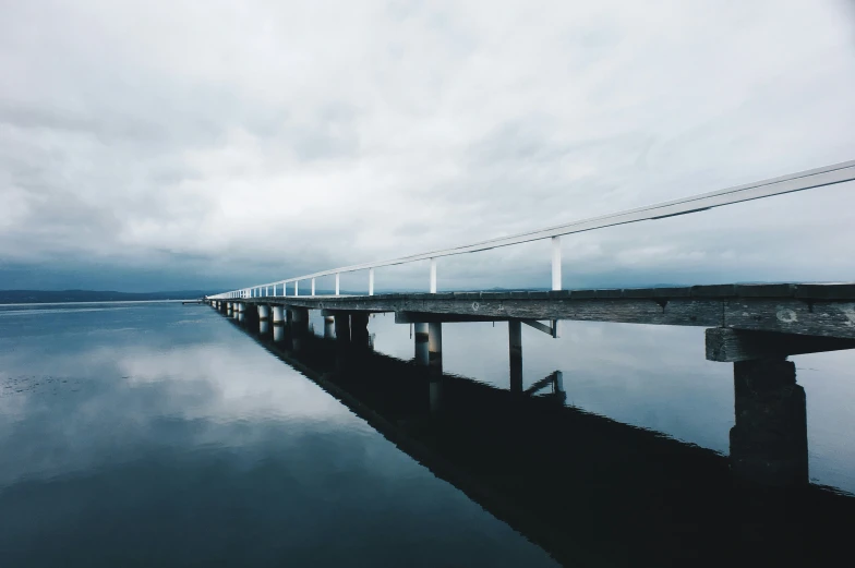 a large long pontoon bridge spanning across water