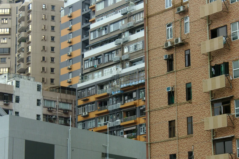 several buildings with windows and balconies on top