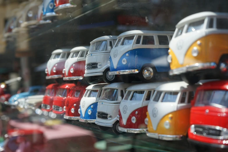 an assortment of small toy cars are on display