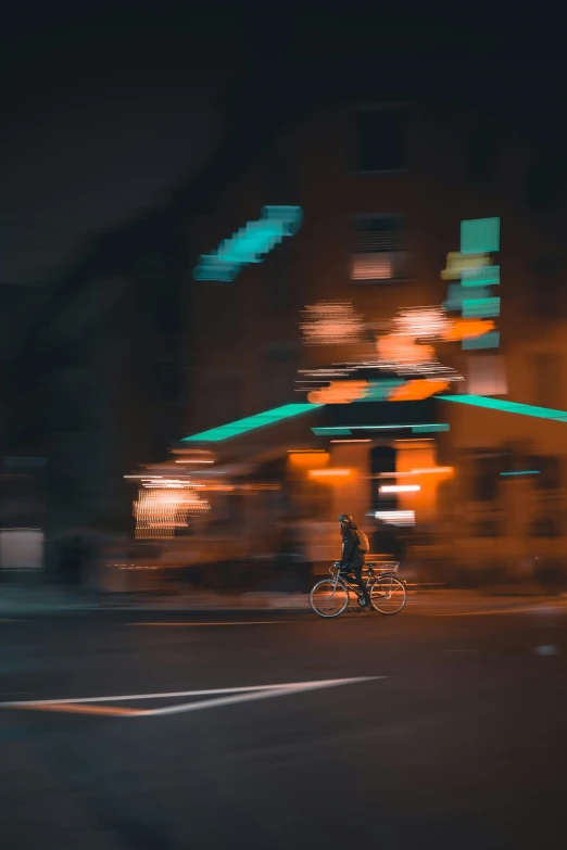 a blurred picture of a person riding a bike