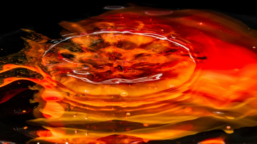 a black and orange abstract image in the middle