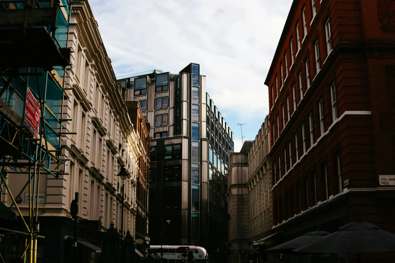 a street with many tall buildings and glass windows