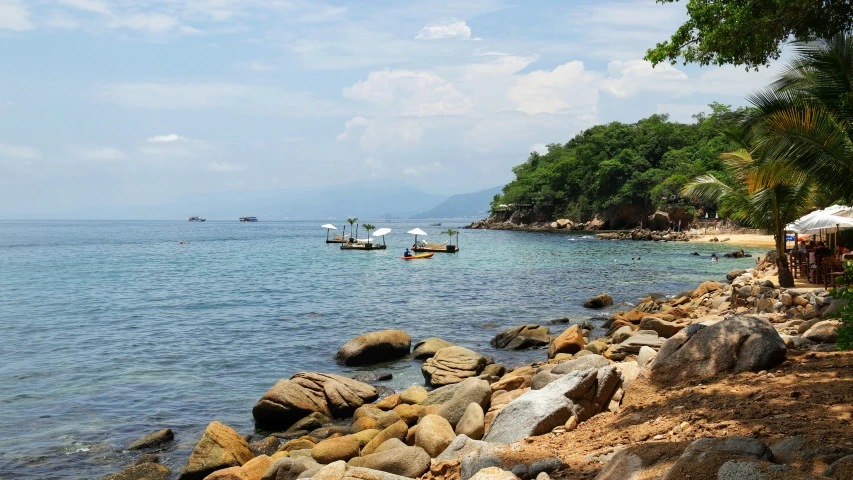 two boats on the sea in a quiet cove