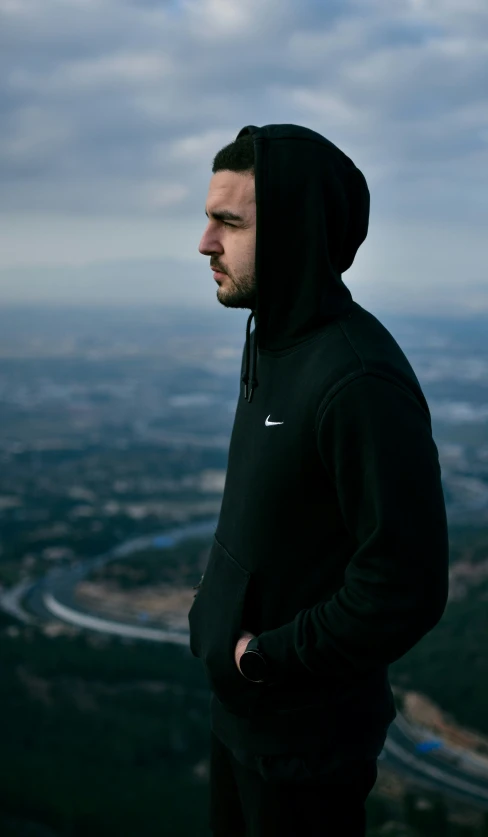 man looking at a scenic city from high above