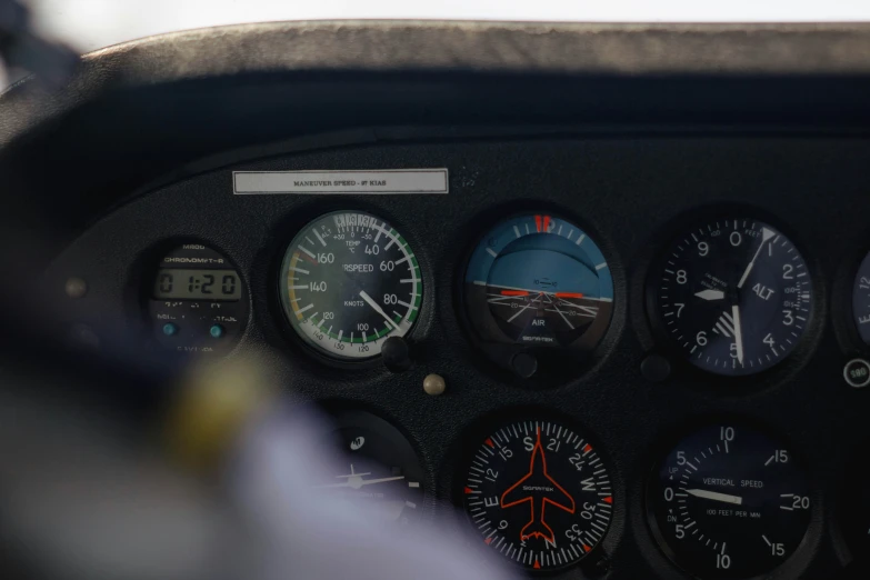 the dashboard of a military plane with many instruments