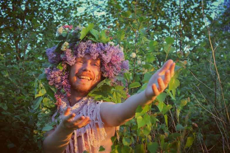 a person wearing flower wigs in a field