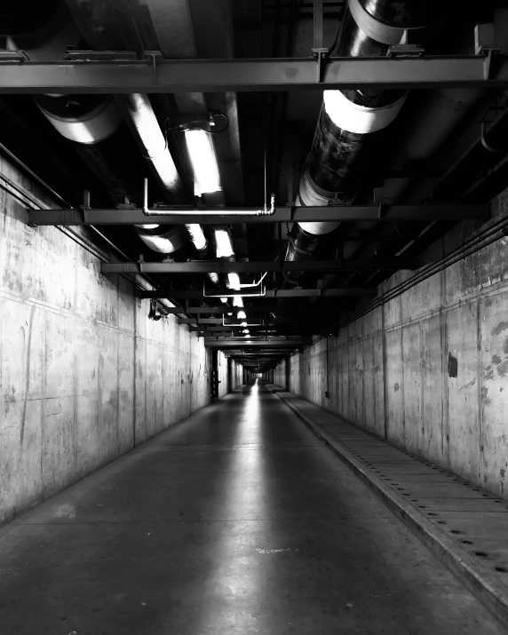 a black and white po of a corridor in a building