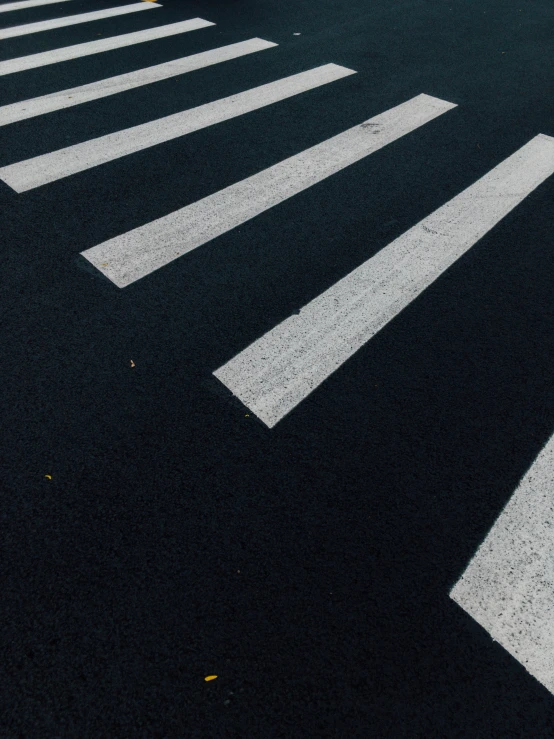 there are two street signs at the crosswalk