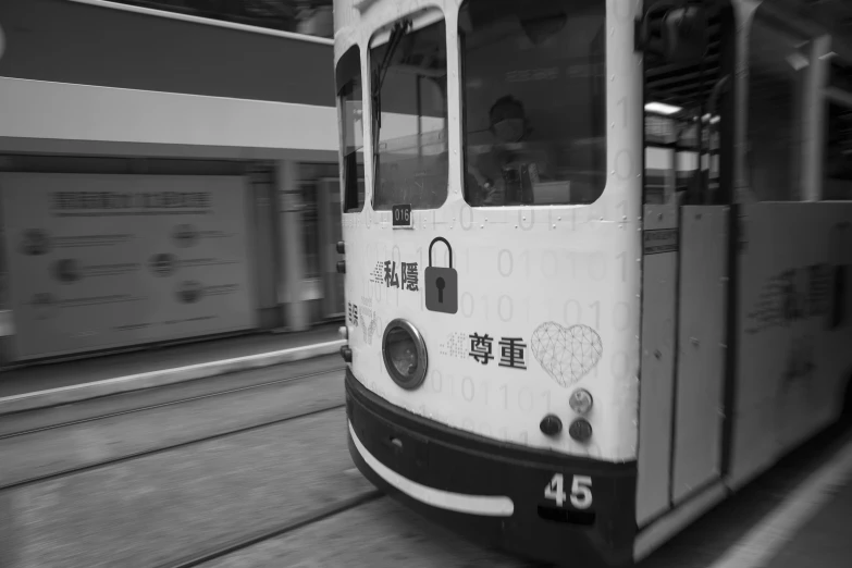 the passenger train is driving fast at night