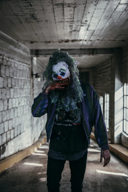 a man in a creepy costume standing on a hallway