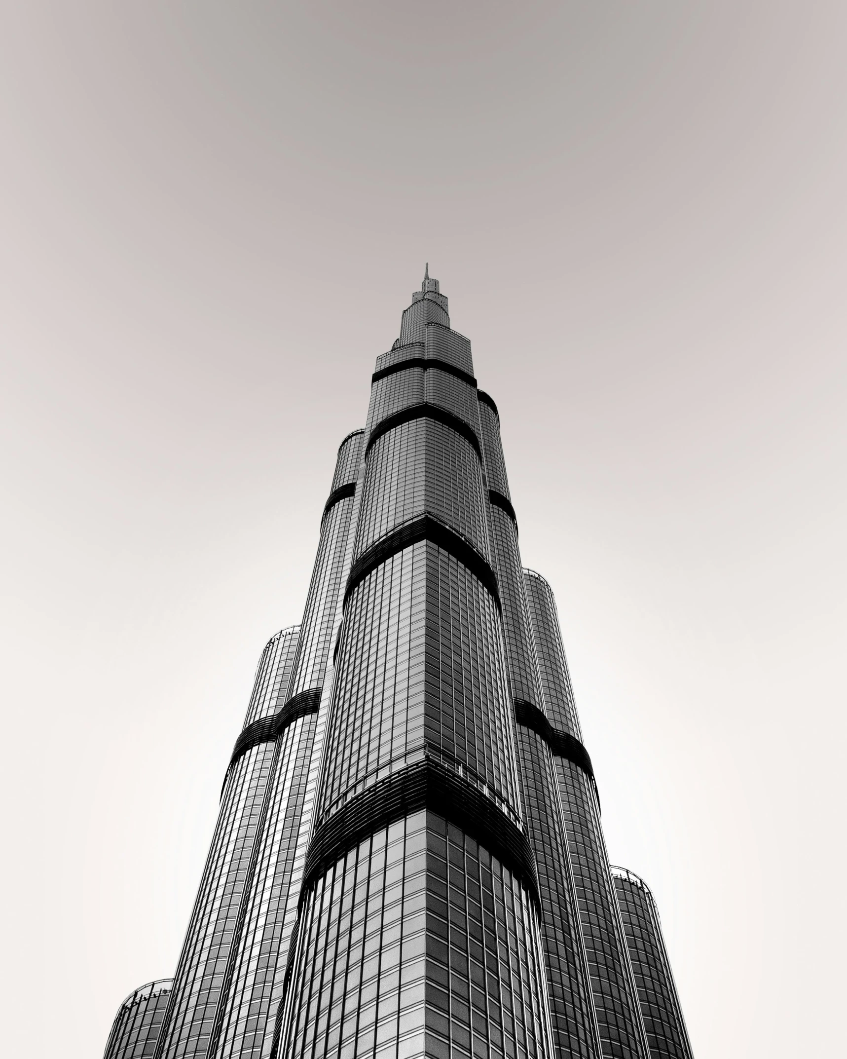 the top of a tall building with an intricate window pattern