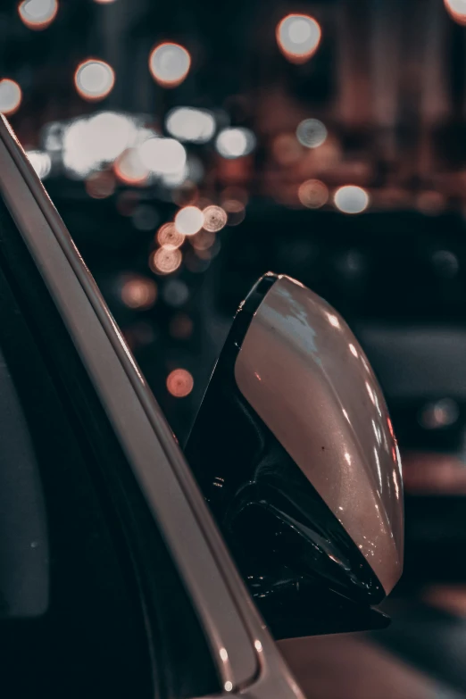 the reflection in the side mirror of a car