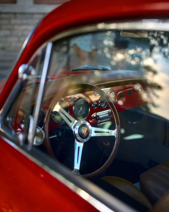 the interior of a classic sports car showing the dashboard