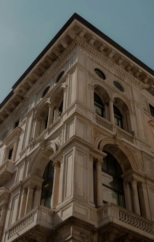 an old building has elaborate architectural details on its sides